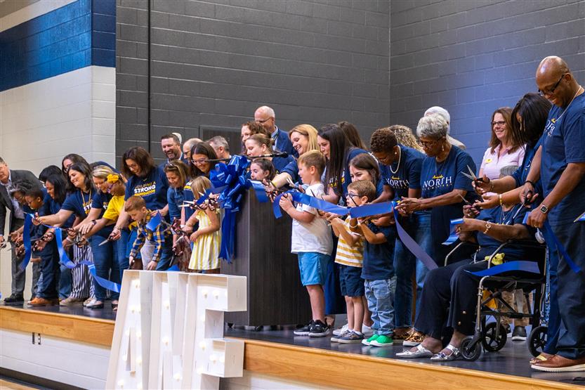 Students cut ribbon at new school